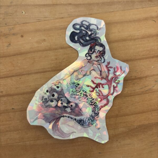 Sticker holographique illustré avec une sirène et un décor marin